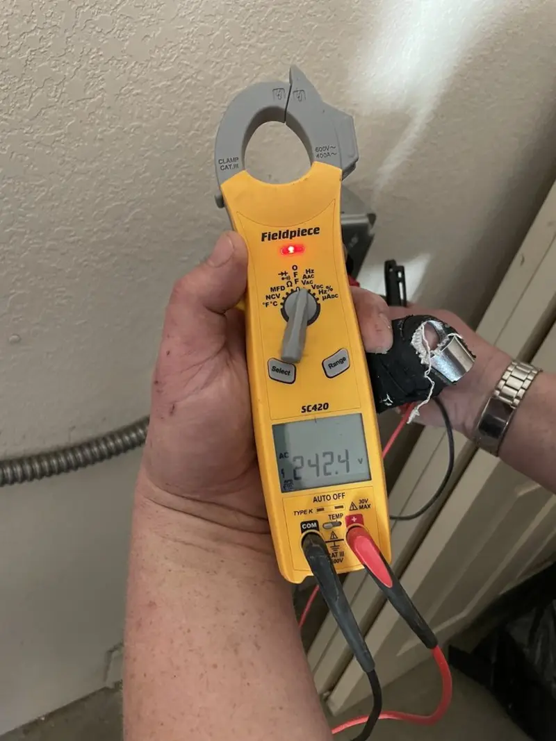 Voltage testing with clamp meter during Generator Installation in San Diego